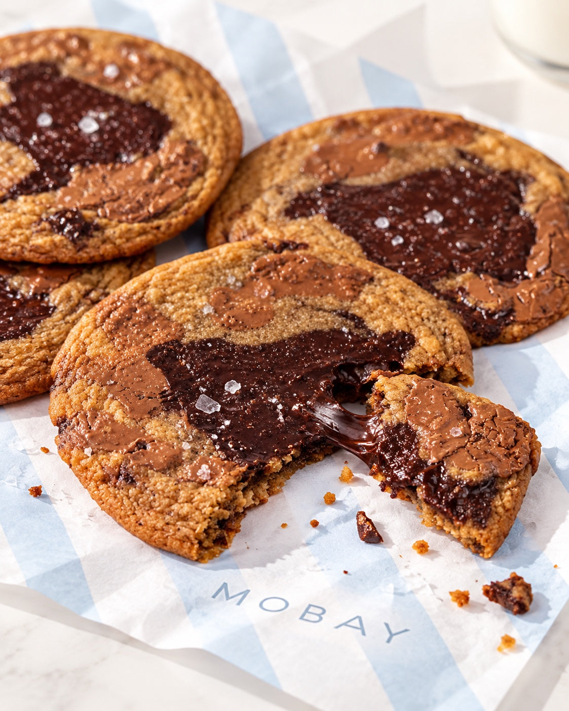 Soft chocolate center of a thin chocolate chunk cookie